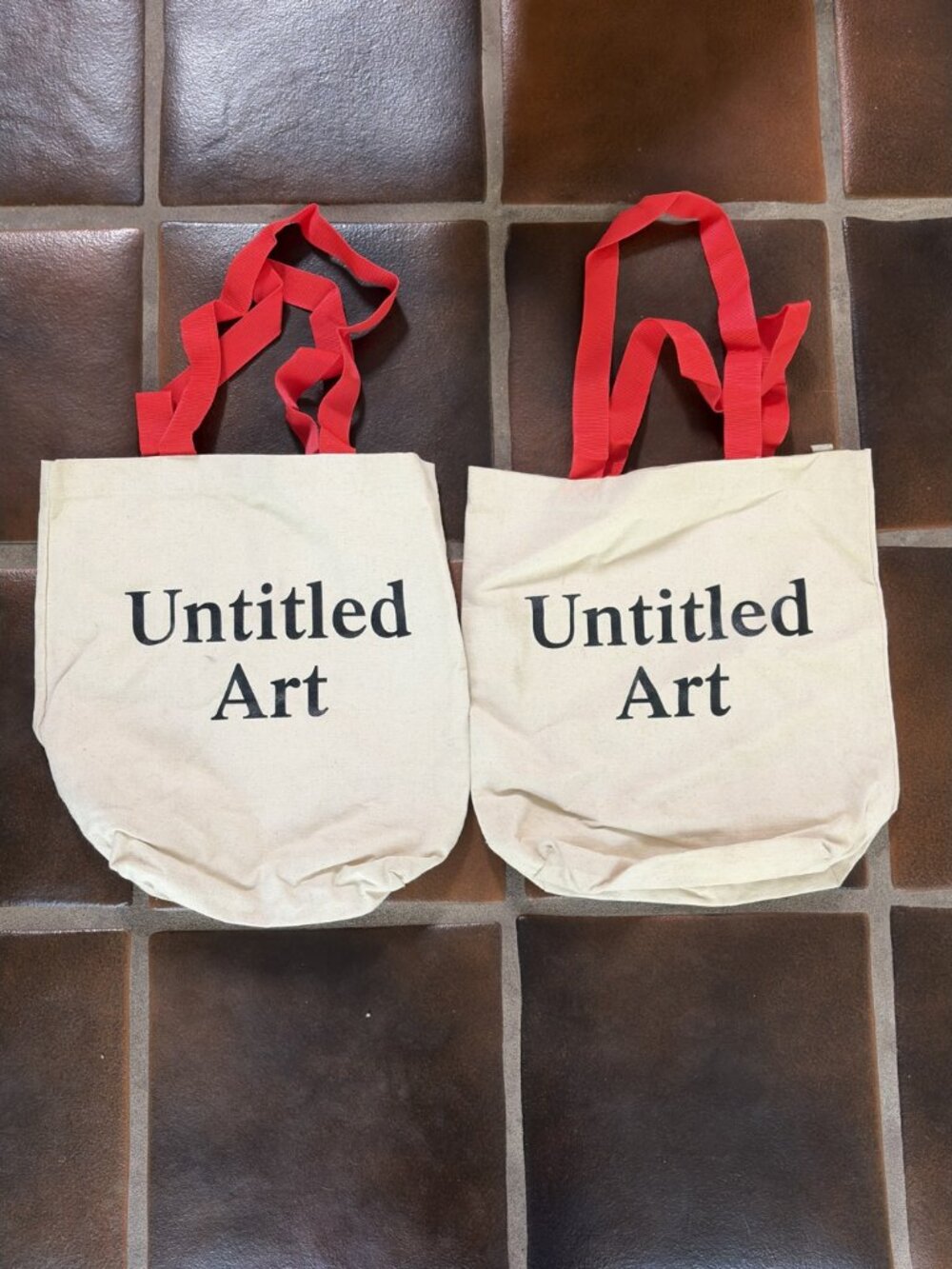 Two Untitled Art Cream Canvas Totes with Red Handles